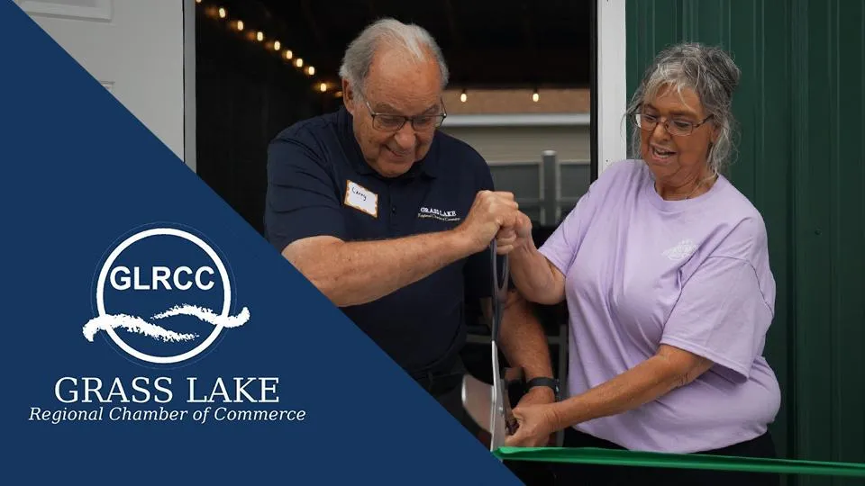 Missy and Larry cutting Ribbon