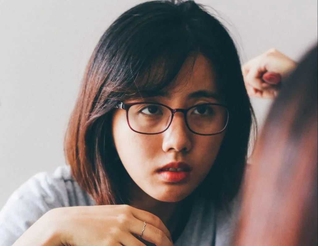 Lady with glasses staring