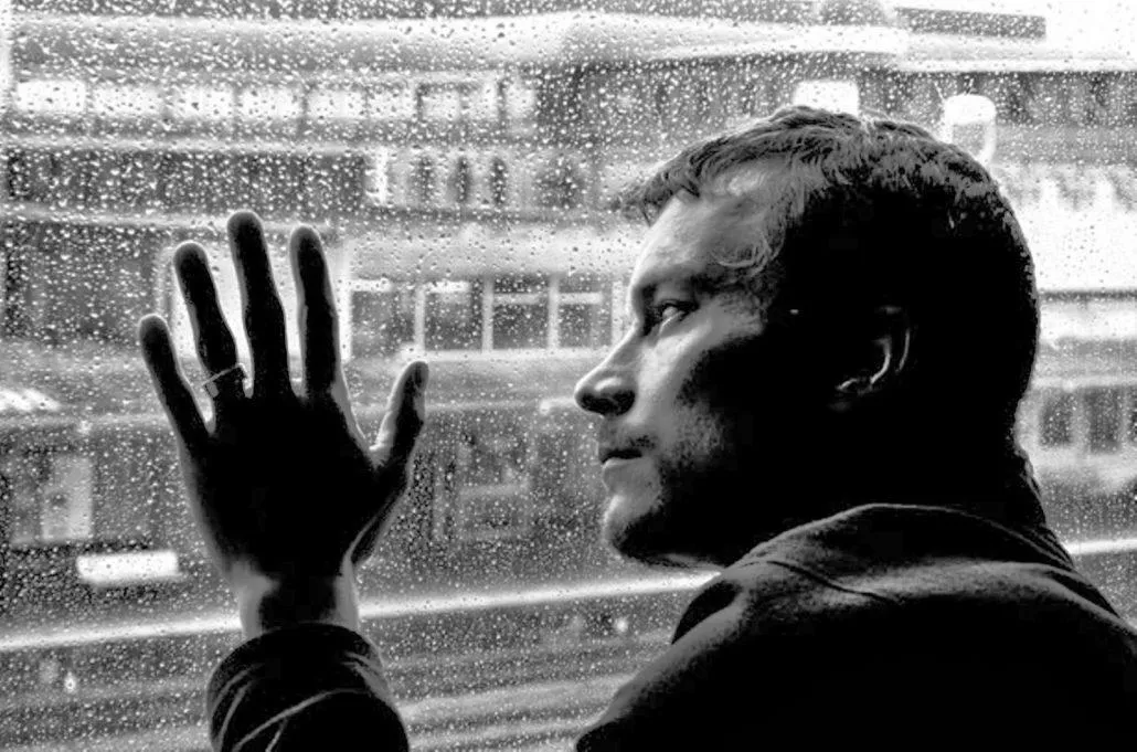 Lonely man at the mirror