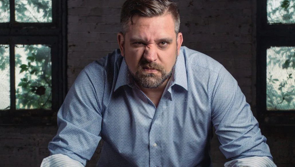 Mad man in blue polo