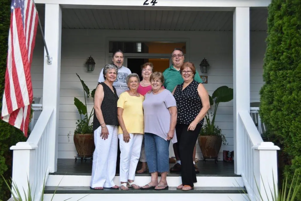 Seven people smiling