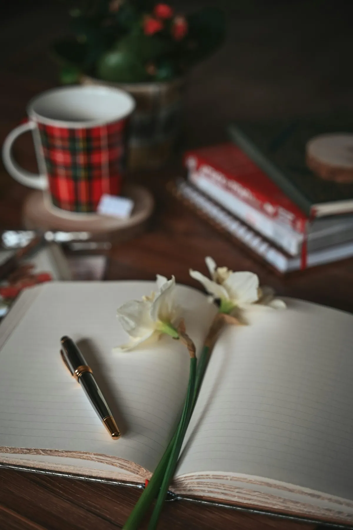 Photo by <a href="https://unsplash.com/@aevelinaphotography?utm_content=creditCopyText&utm_medium=referral&utm_source=unsplash">Evelina Photography</a> on <a href="https://unsplash.com/photos/a-notebook-with-a-pen-and-flowers-on-a-table-4IT8JaW1Pa0?utm_content=creditCopyText&utm_medium=referral&utm_source=unsplash">Unsplash</a>