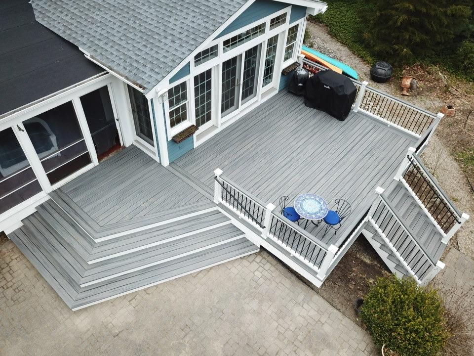 Grey composite deck with herringbone inlay and white railing - pergola installation by Prime Decks in Wilmington, DE