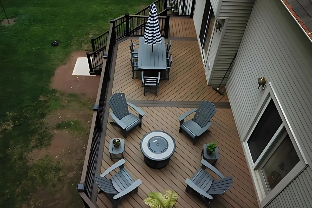 Composite deck with Adirondack chairs and fire pit table viewed from above - deck building by Prime Decks in Wilmington, DE