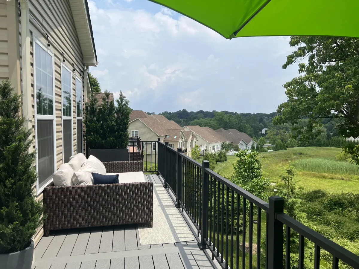 Composite deck with black aluminum railing overlooking a Delaware neighborhood - deck design by Prime Decks in Wilmington, DE