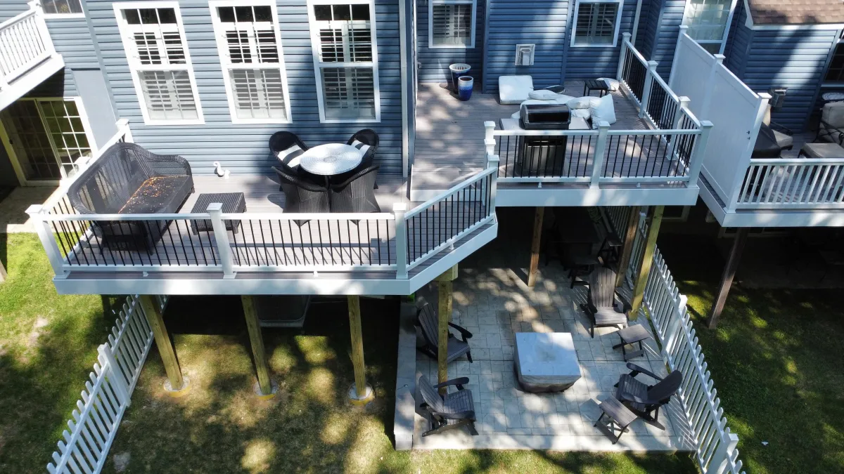 Aerial view of a two-tier deck with lower patio and outdoor furniture - deck building by Prime Decks in Pike Creek, DE