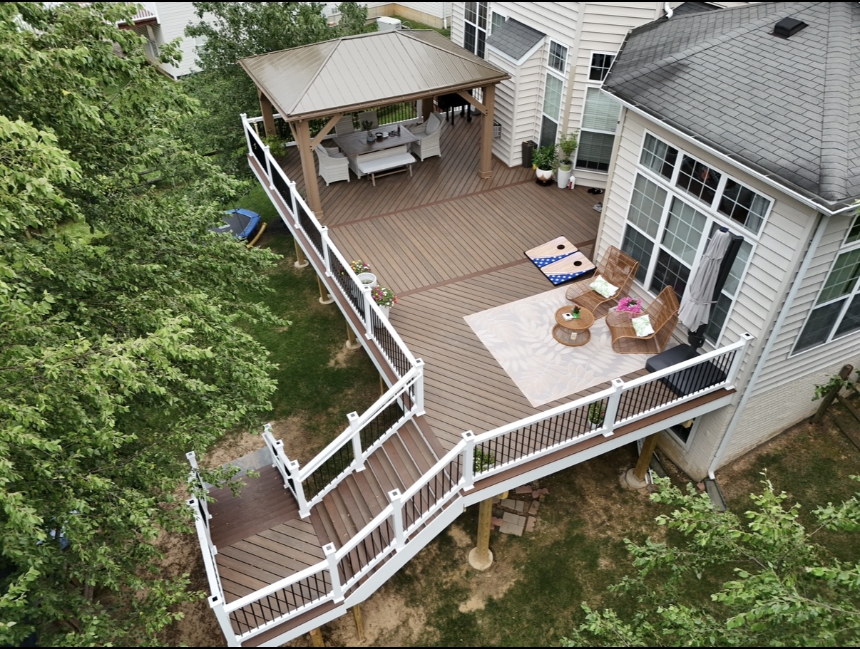 Aerial view of a composite deck with white railings, gazebo and lounge seating - deck building by Prime Decks in Wilmington, DE
