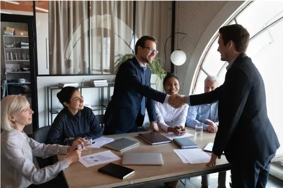 HR team conducting a successful job interview with diverse professionals in a modern office setting, showcasing recruitment, employee engagement, and workplace collaboration.
