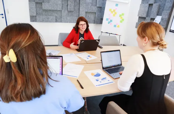 Diverse business team collaborating in a psychologically safe office environment