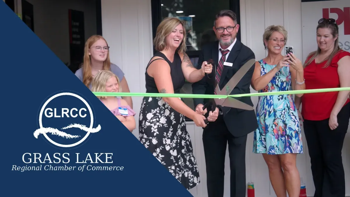 Ribbon being cut at Production Realty Grass Lake