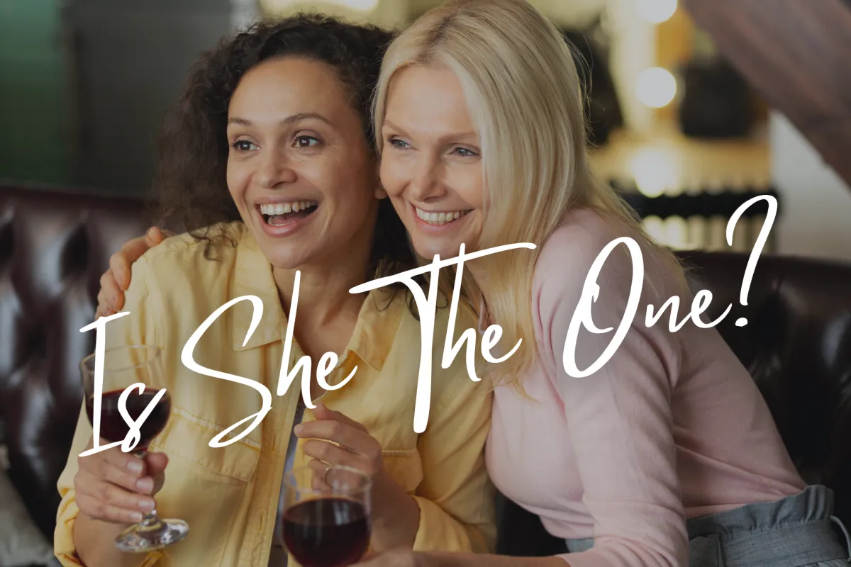 two lesbians drinking red wine together