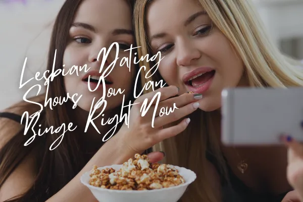 Girlfriends eating popcorn and watching a show on the phone