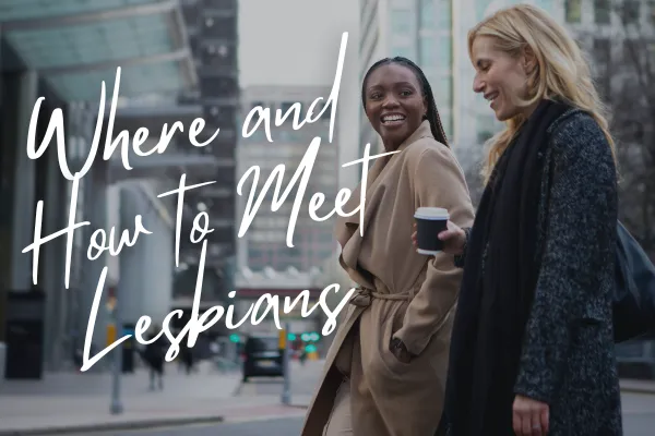 Lesbian acquaintances walking together in the city and drinking coffee