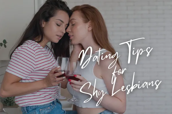 beautiful lesbian couple cheering with some wine