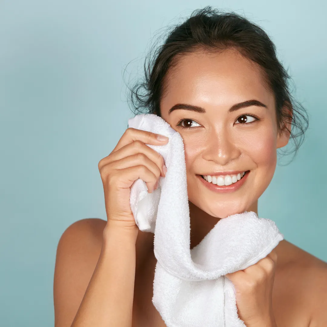 Girl washing face, participating in skincare process