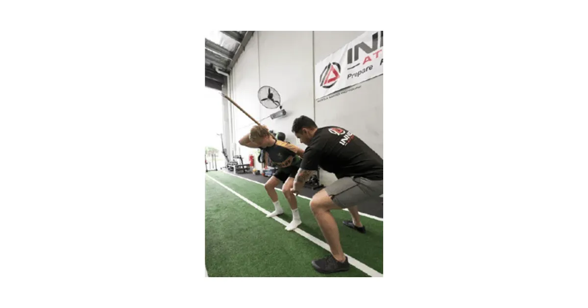 Coach Trent training a youth on the movement fundamentals