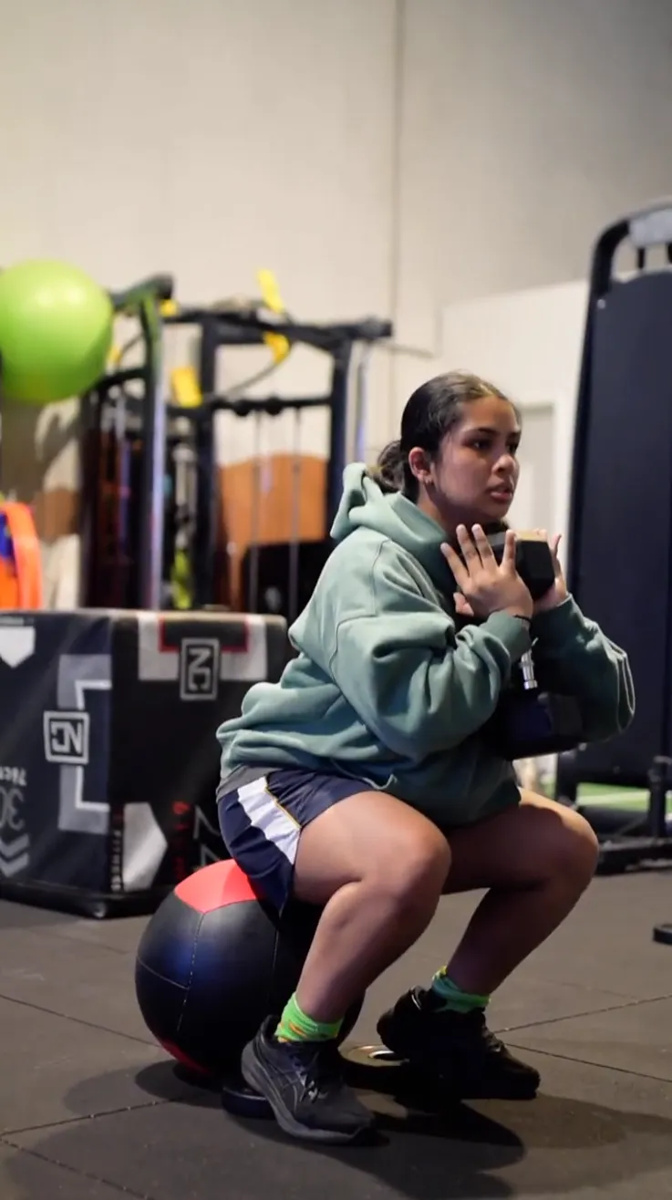 youth athlete undertaking weight training
