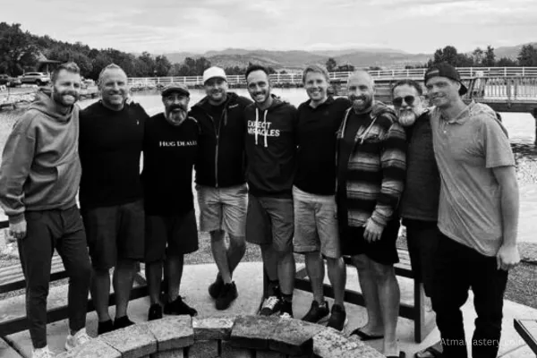 Group of men practicing accountability and teamwork at the RISE Sovereign event, symbolizing growth through challenges and open communication.