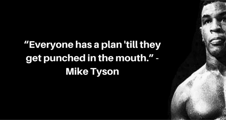 Black and white image of Mike Tyson with his famous quote: 'Everyone has a plan 'till they get punched in the mouth,' symbolizing resilience and adaptability in life's challenges.