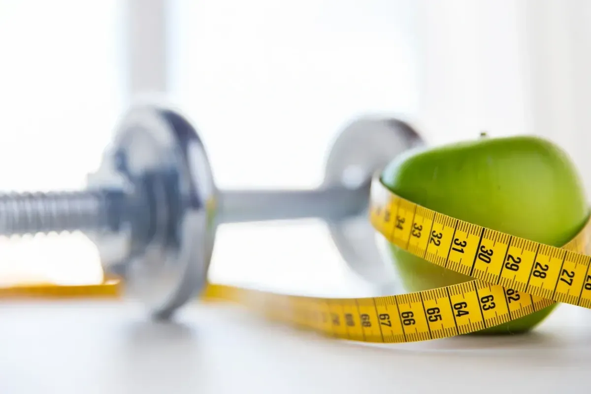 weight loss- green apple and measuring tape