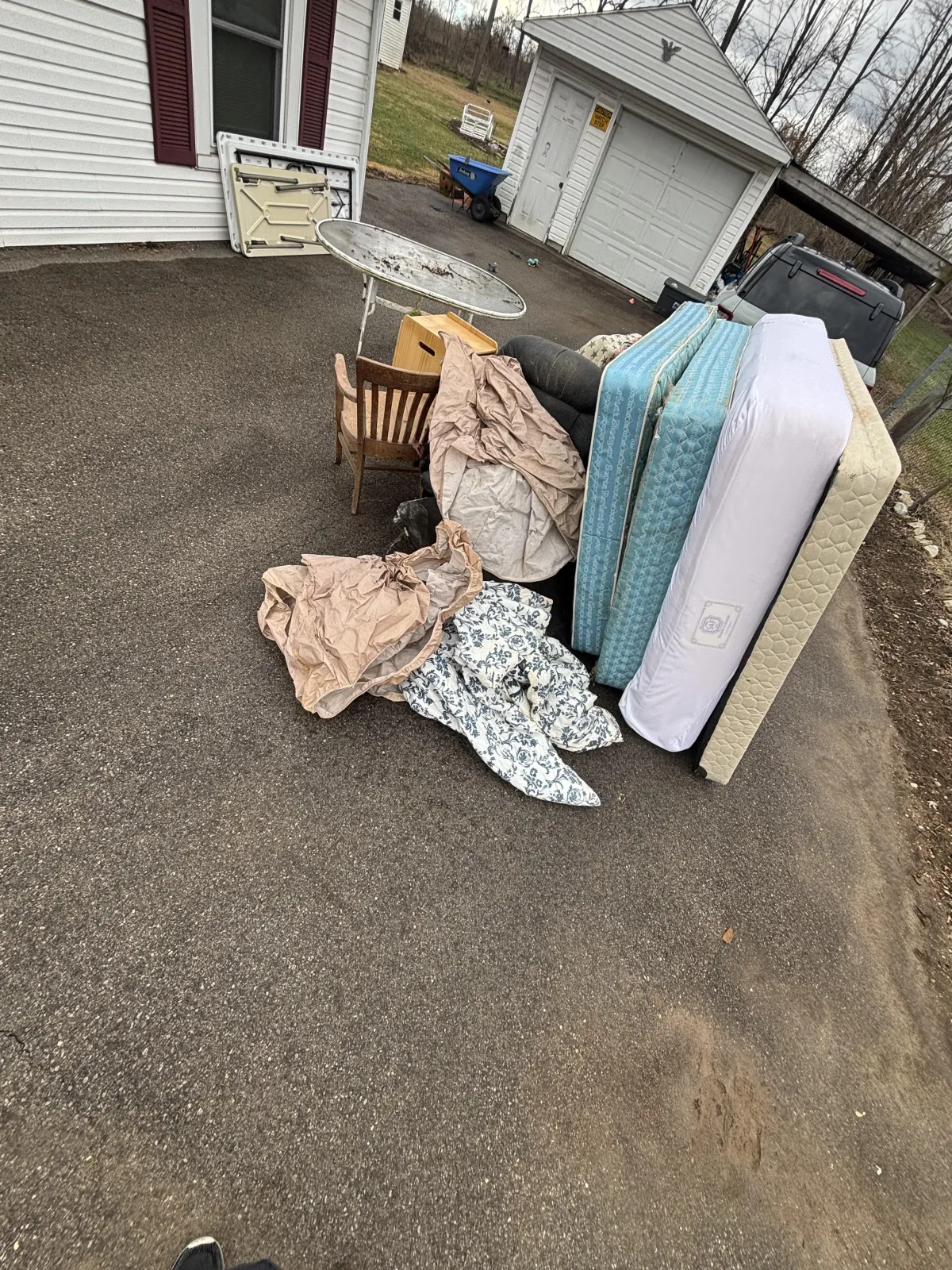 Junk pile in driveway before curbside junk pickup in Dayton Ohio