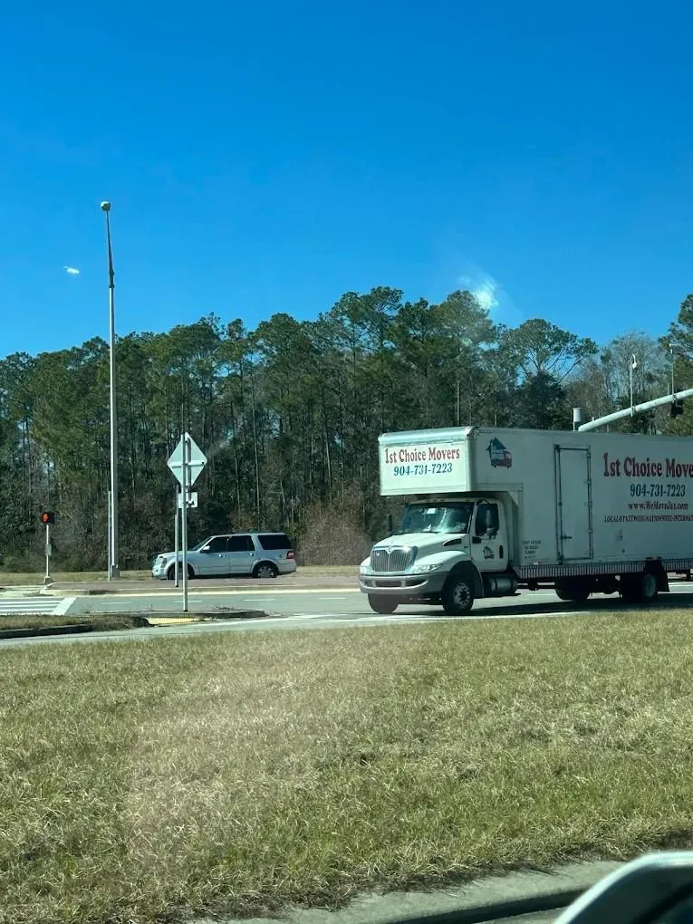 1st Choice Movers truck on the road