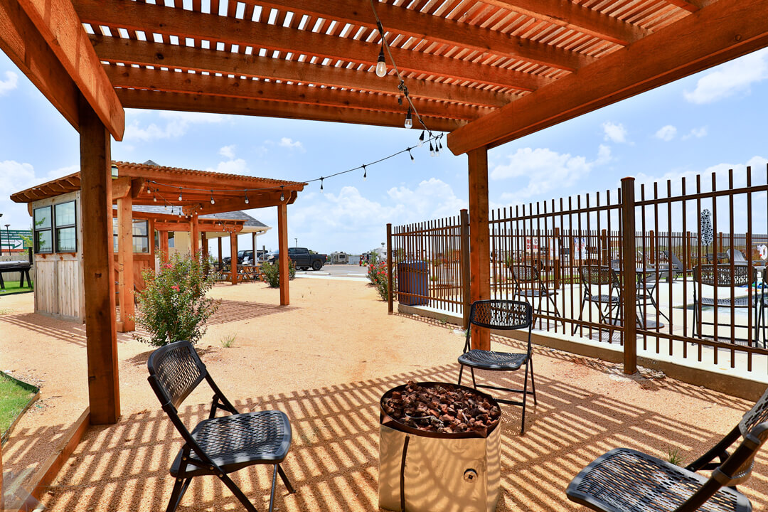communal fire pit area by swimming pool at ridgeview rv resort