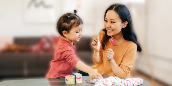 Mother and child practicing skills using ABA strategies