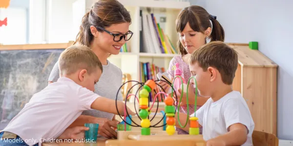 Children playing with an ABA professional