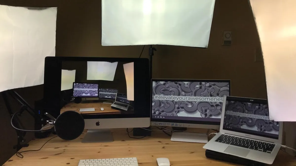 a photo of an ideal setup with studio lighting, multiple screens and a professional microphone