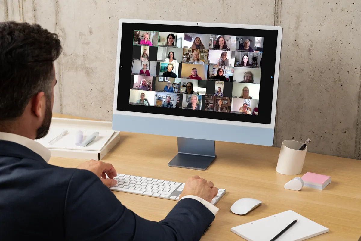 person at a computer attending an online event in Zoom