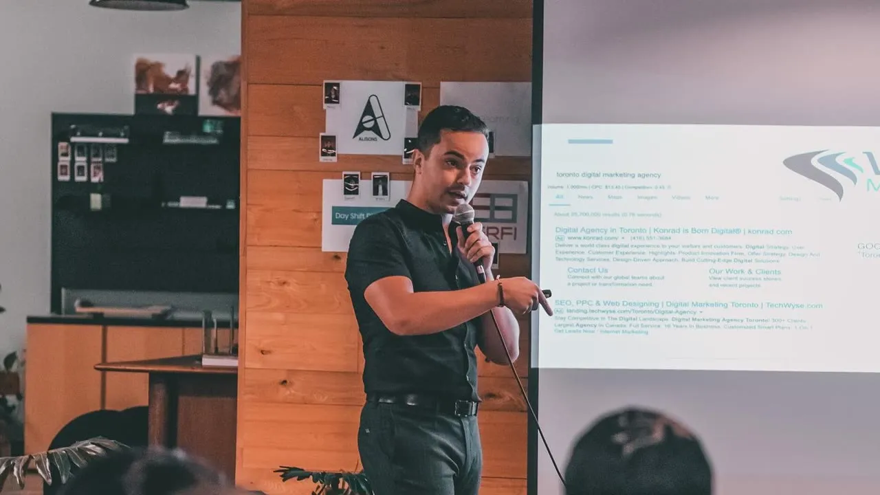 Avi Grondin presenting to a room in Toronto