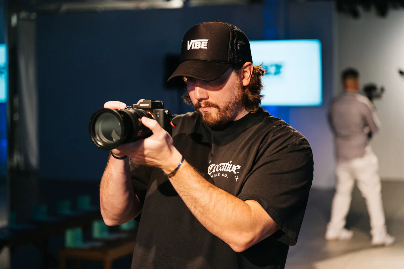 Creative Vibe camera operator lining up a runway shot