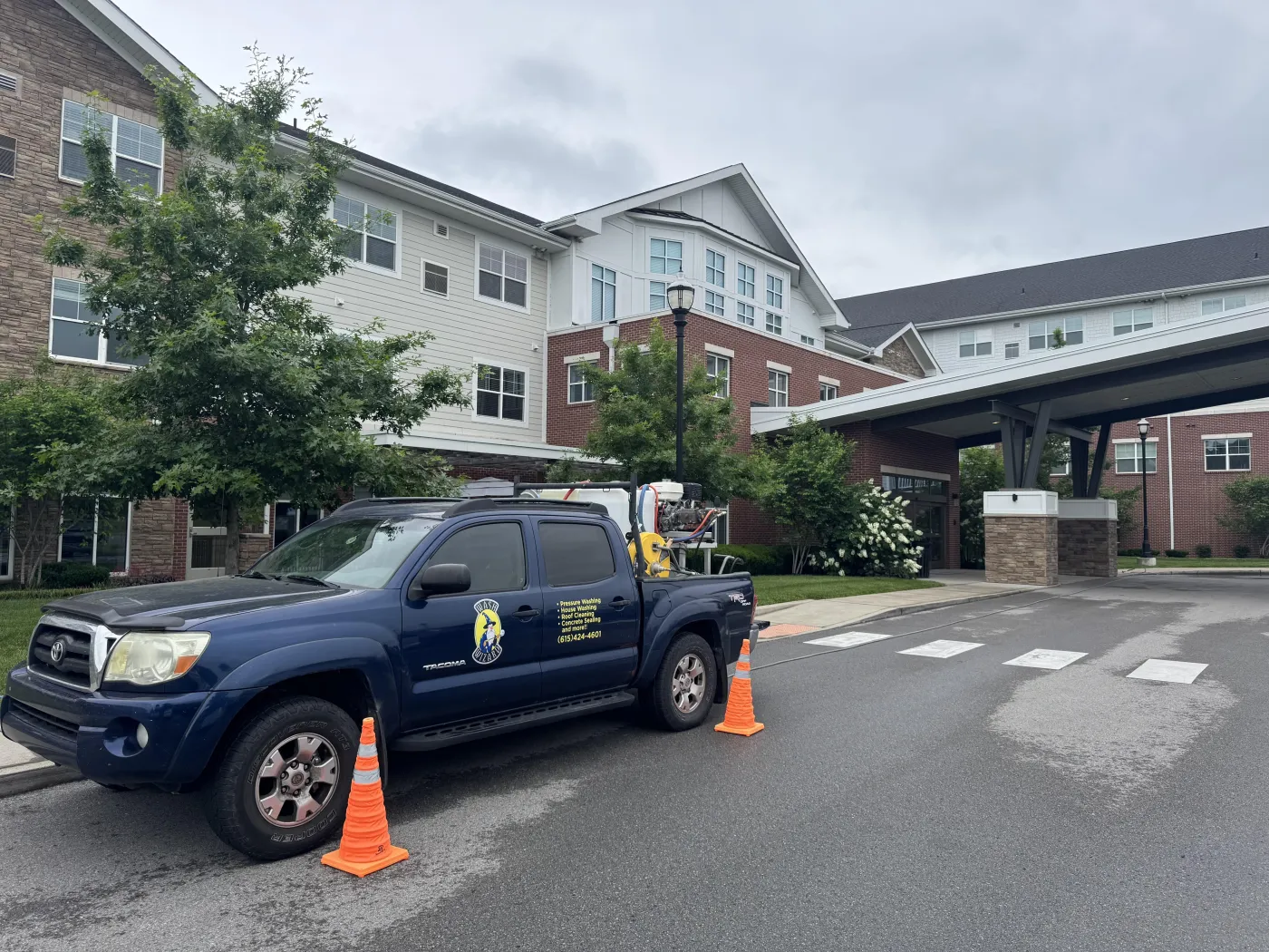 Wash Wizard truck set up at a large apartment complex for commercial pressure washing