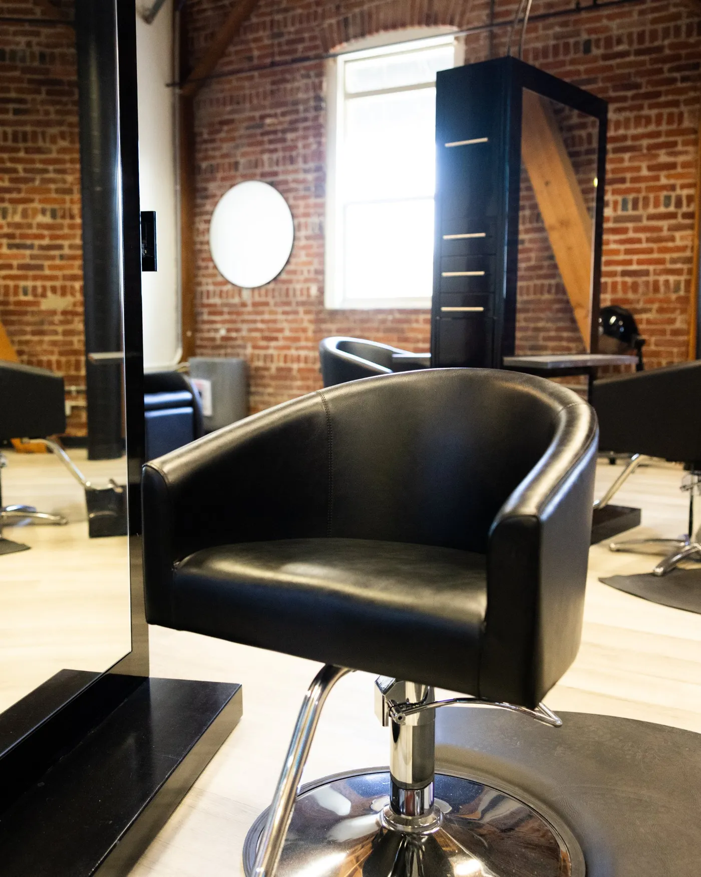 Black styling chair and station in natural light