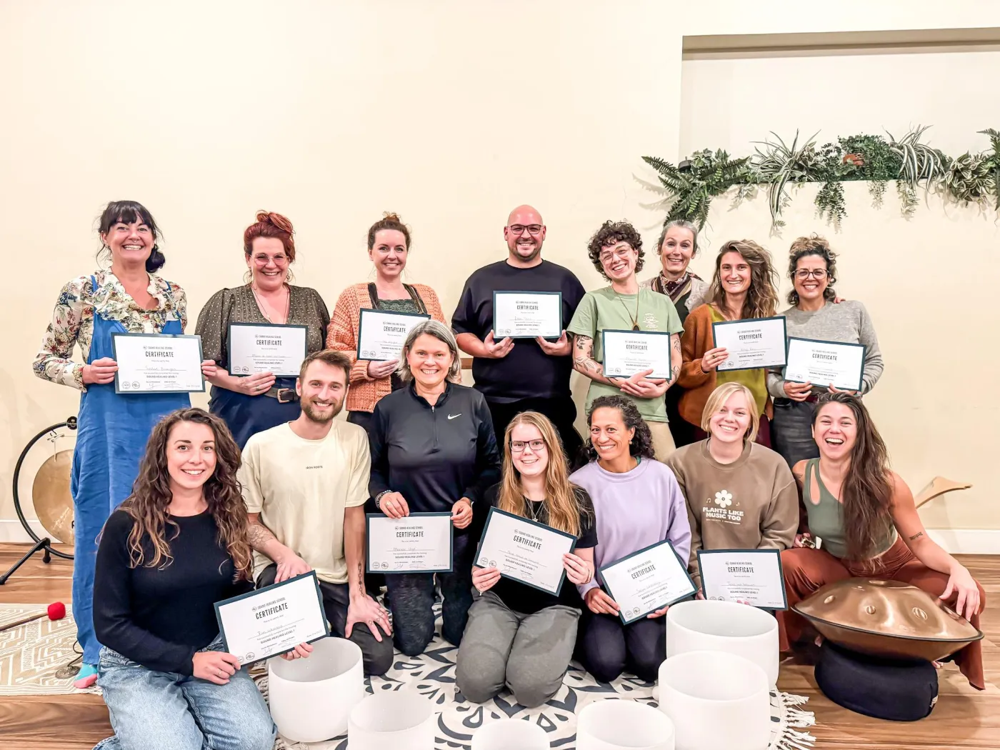 Graduates of the Sound Healing School with their certificates