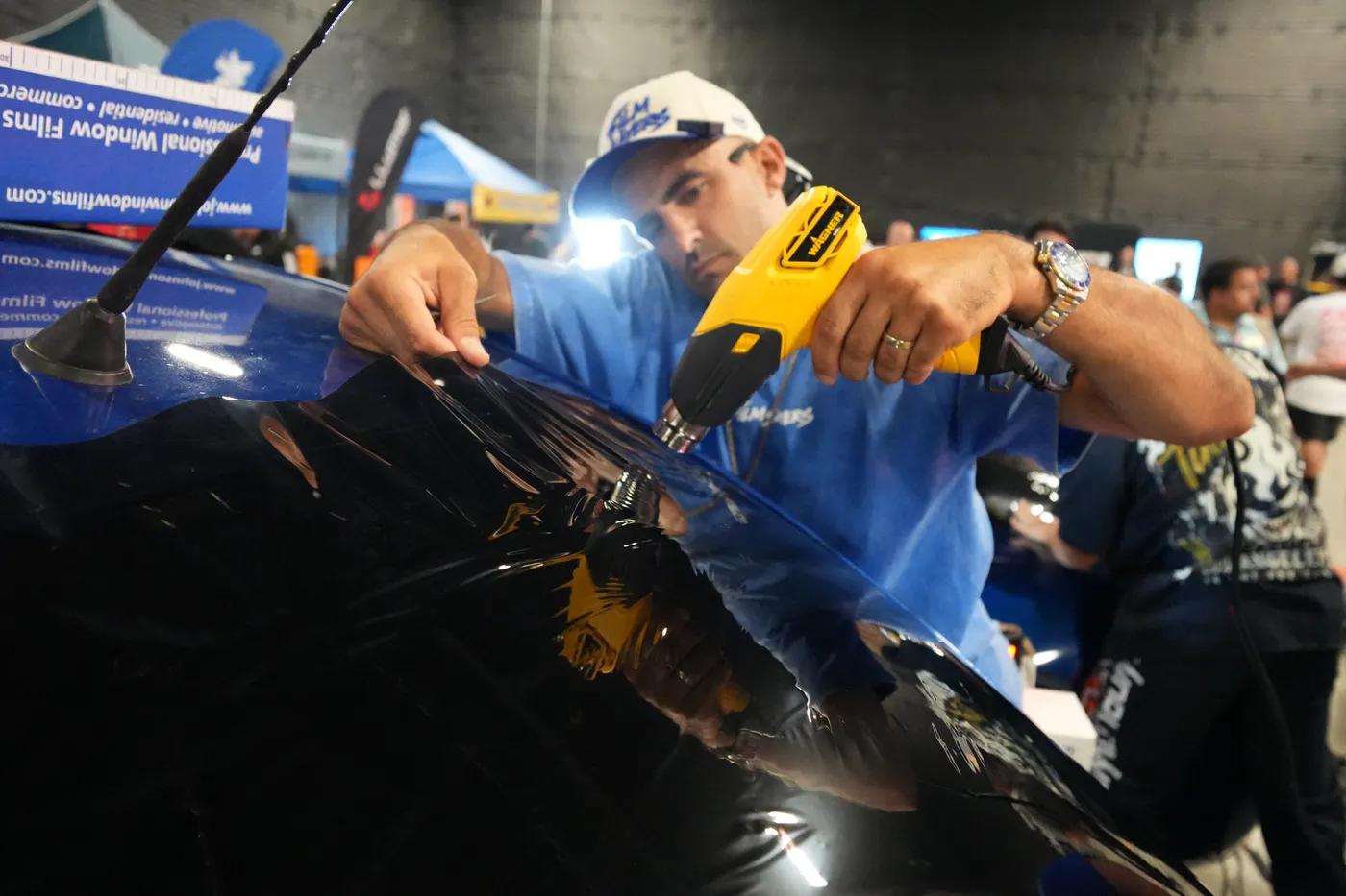 Austin Cook heat shrinking window film at SEMA