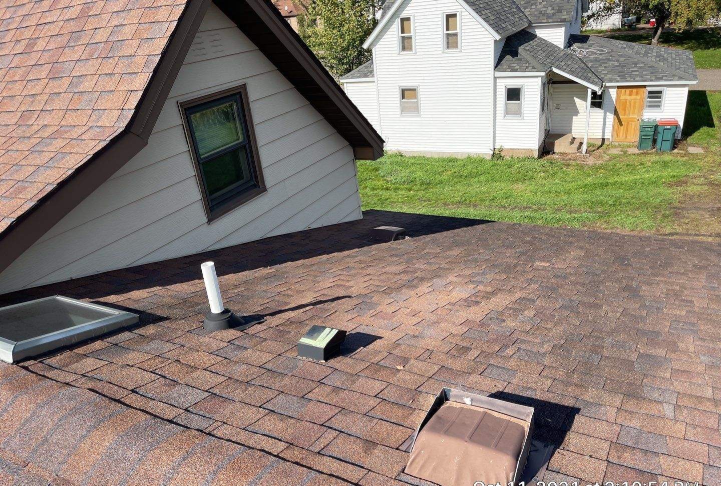 Box roof vents and a vent pipe on an asphalt shingle roof