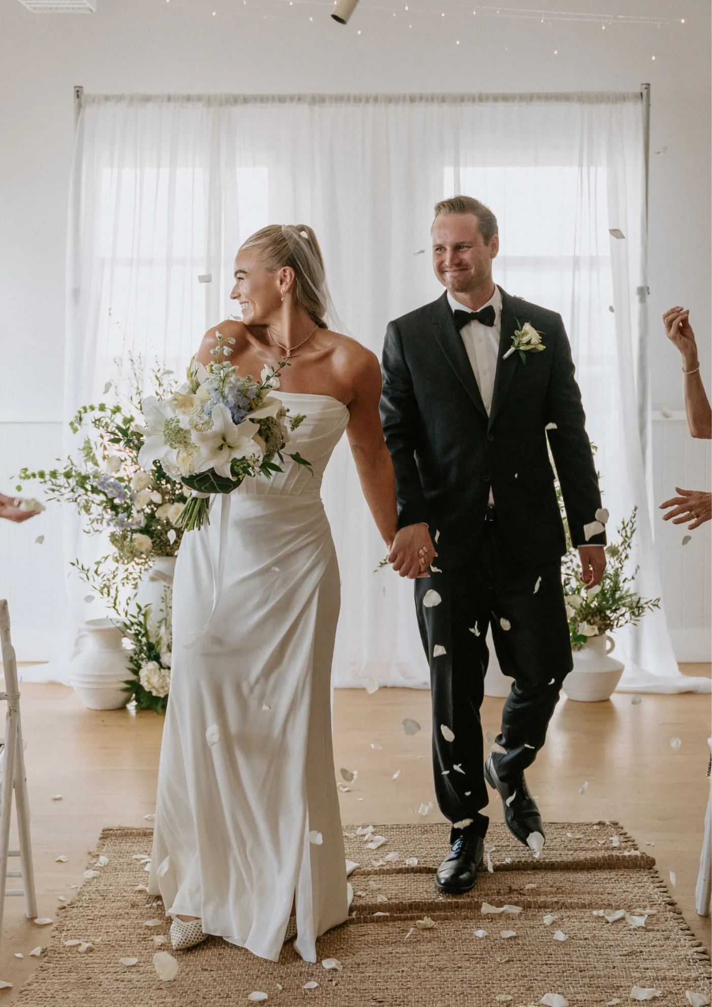 Newlyweds walking back down the aisle