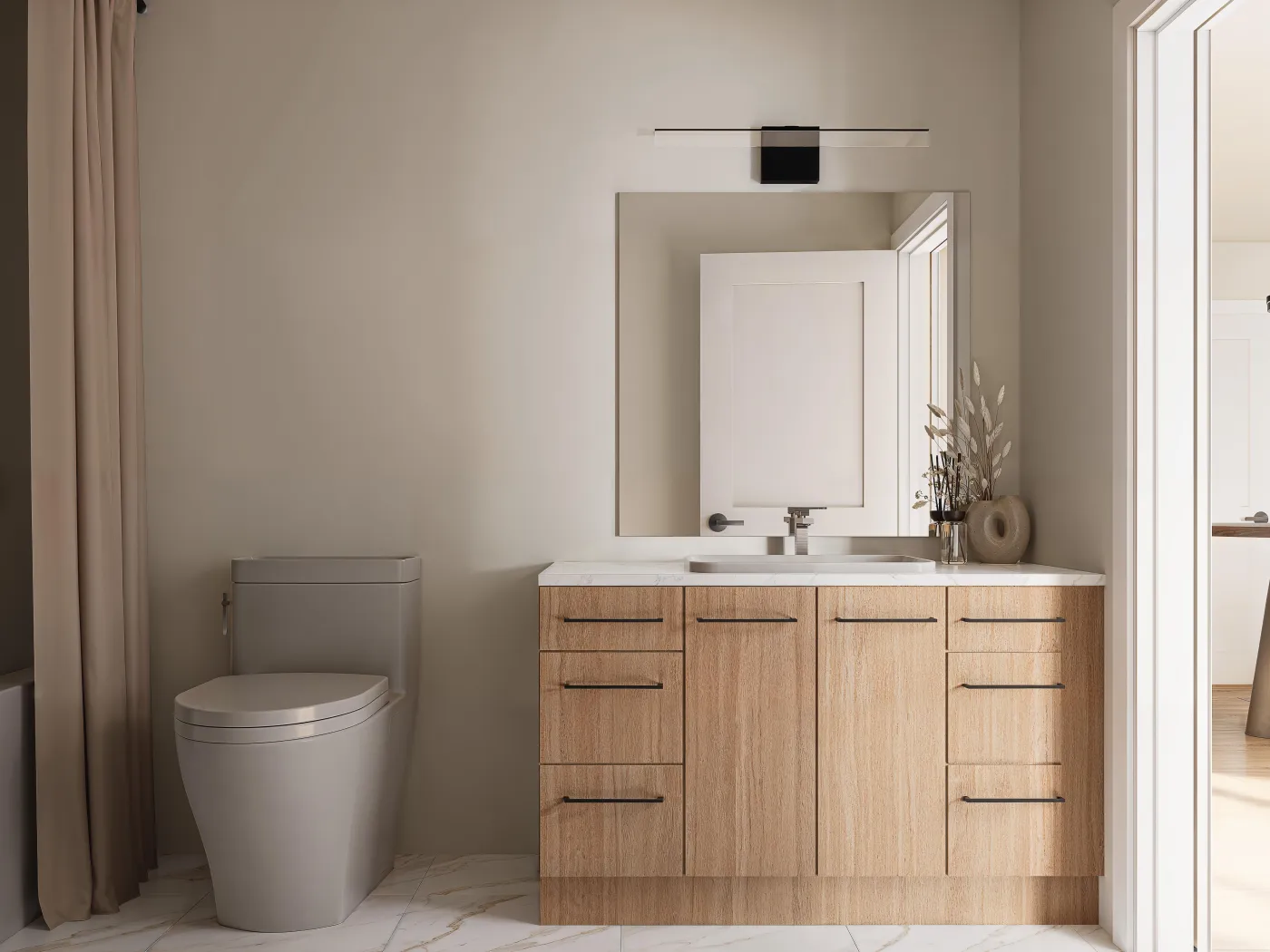 Bathroom with a wood vanity, mirror and toilet