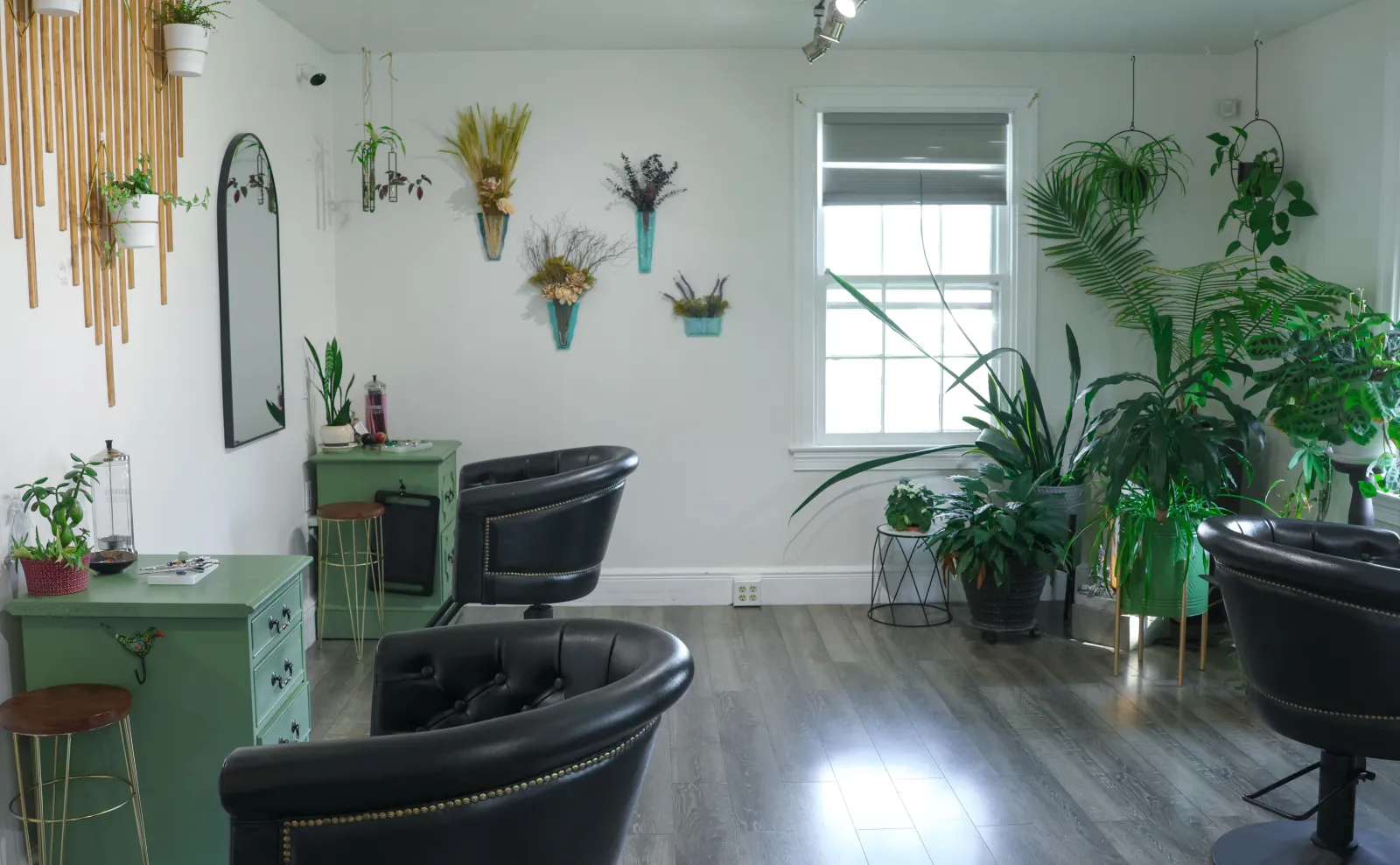A calm, plant filled clean beauty salon space
