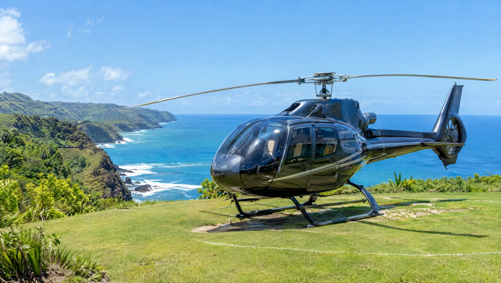 Helicopter landed on a clifftop pad above the ocean