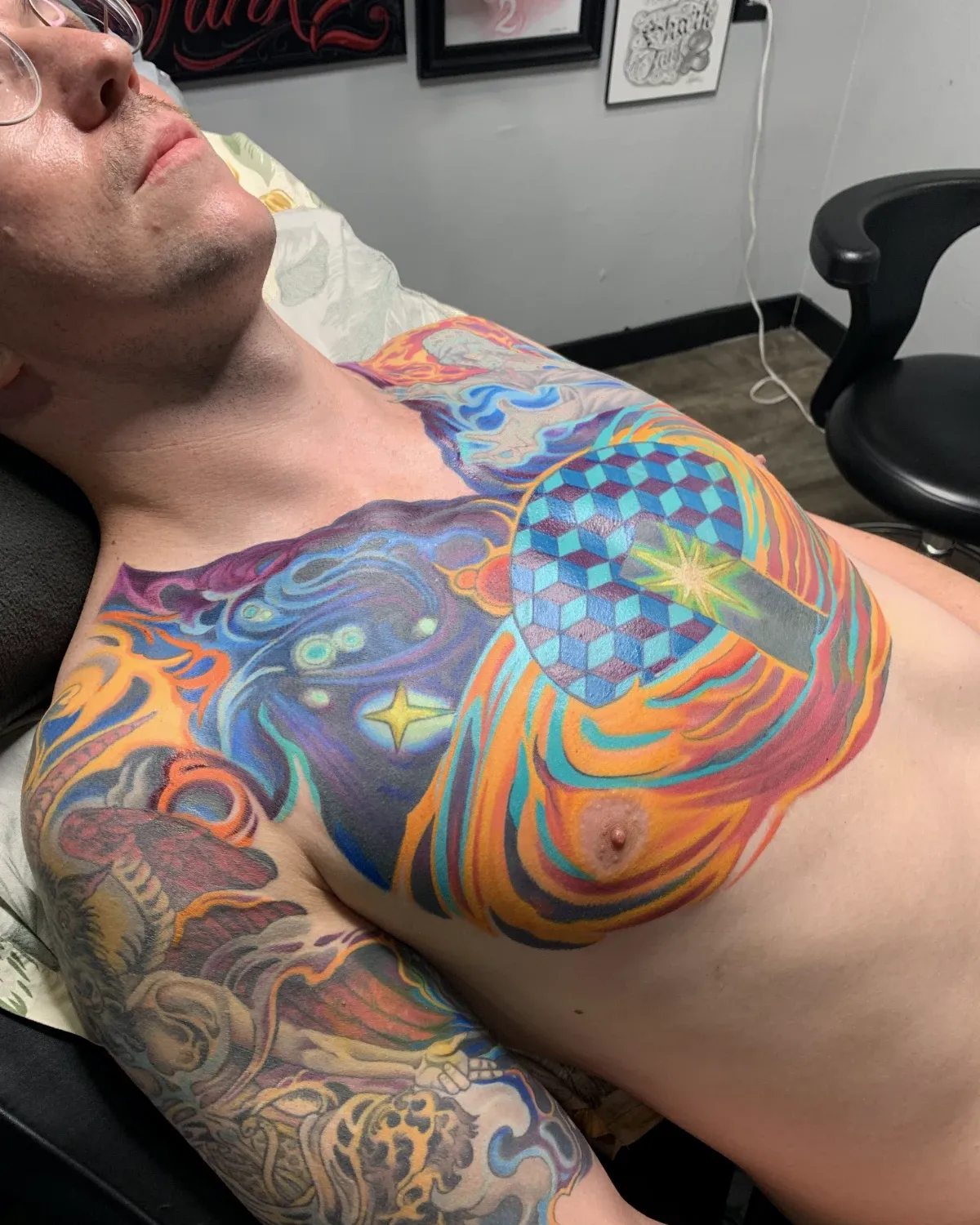 Color psychedelic chest tattoo with surreal ornamental imagery by Nicole Miller of Symbol Maker Tattoo in Missoula, Montana