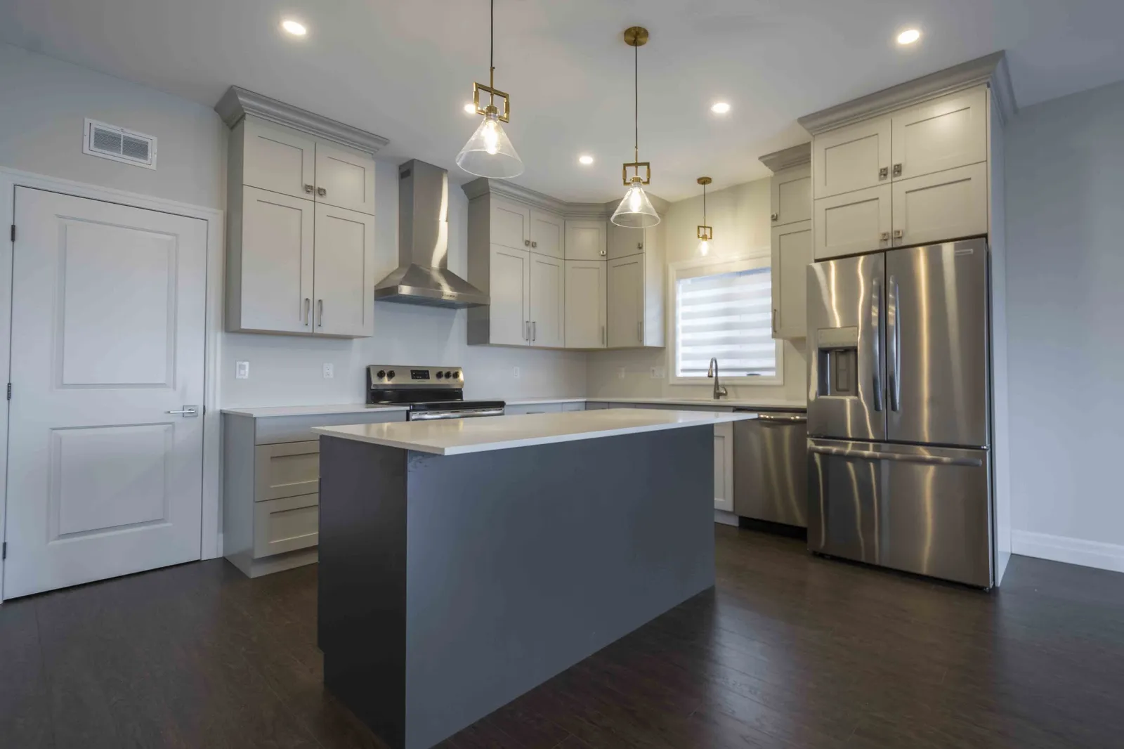 Kitchen with island and pendant lights