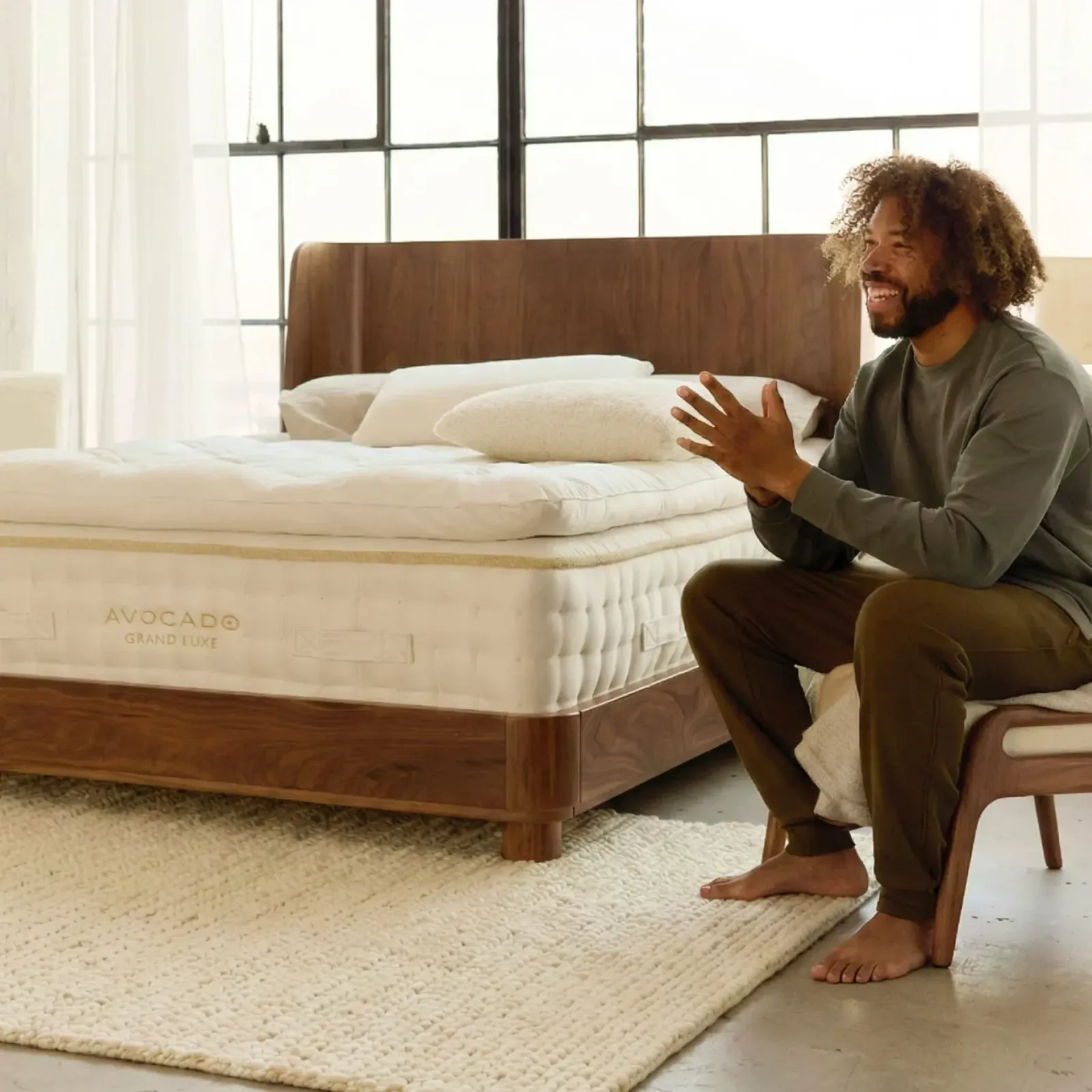 The Grand Luxe Mattress by Avocado being made up in a sunlit bedroom