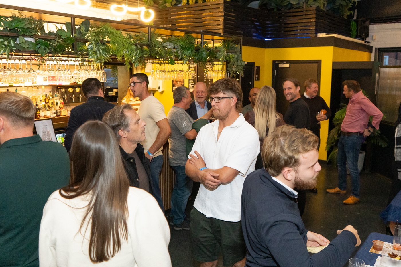 Guests networking around the bar at UK Homes Network LIVE Leeds