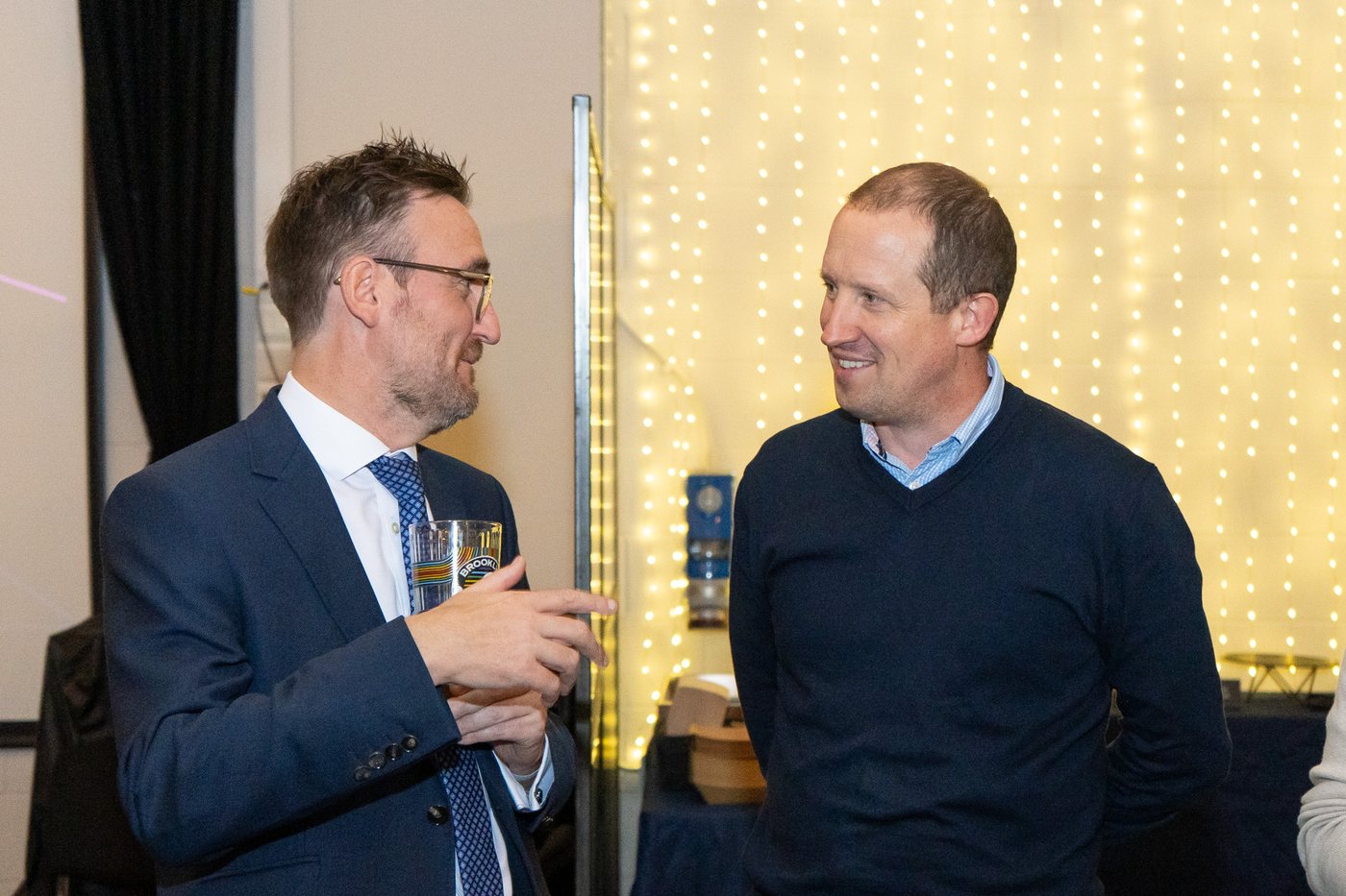 Two guests talking over drinks at UK Homes Network LIVE Leeds