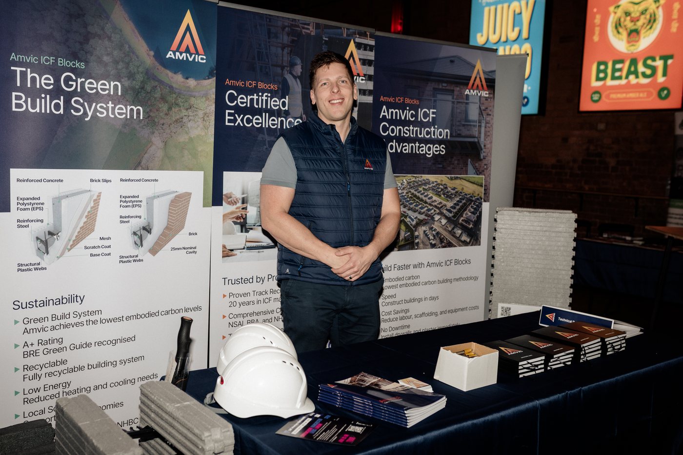 An exhibitor on a construction systems stand at UK Homes Network LIVE Birmingham