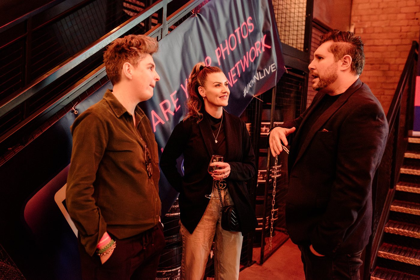 Guests talking on the stairs inside the Indian Brewery taproom at UK Homes Network LIVE Birmingham