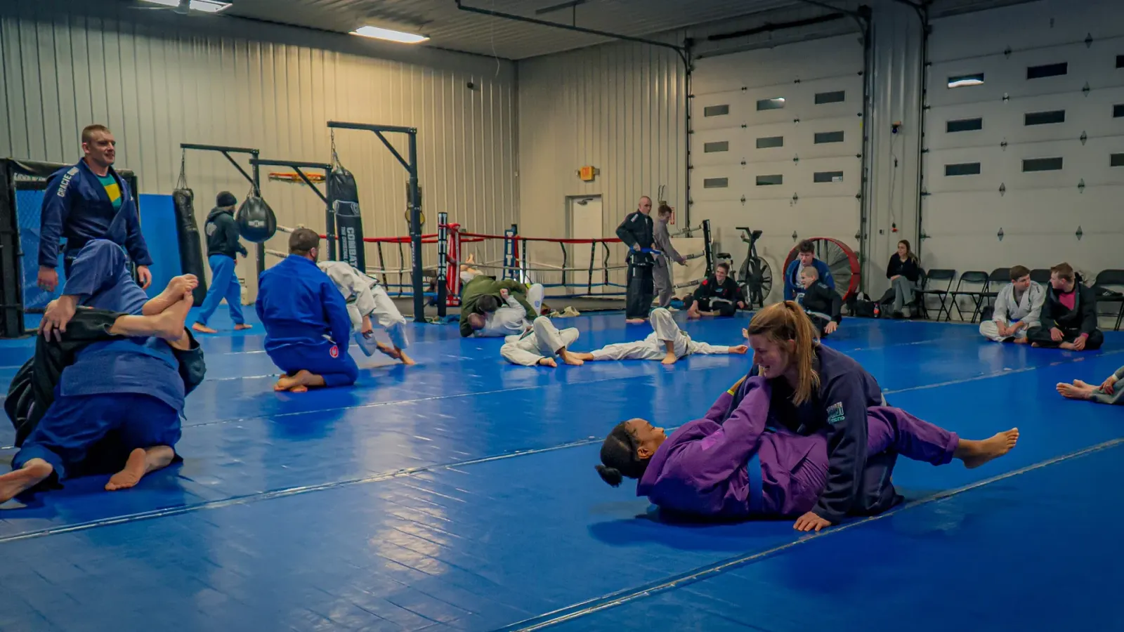Students rolling during a jiu-jitsu class at Delta, minutes from downtown Newark